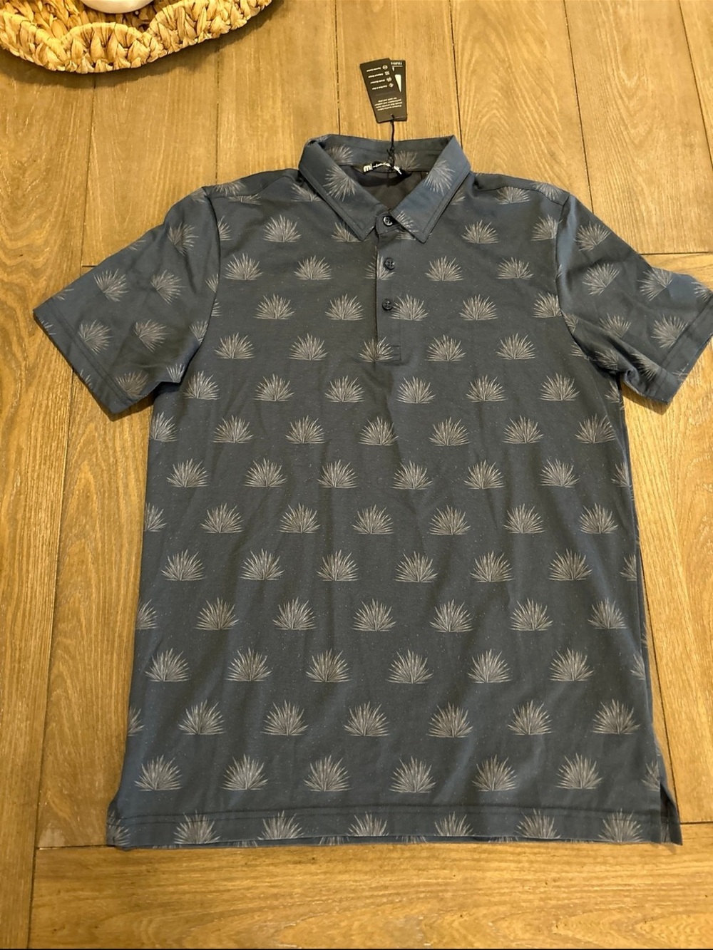 TravisMathew Slate Blue Polo with Light Gray Botanical Print